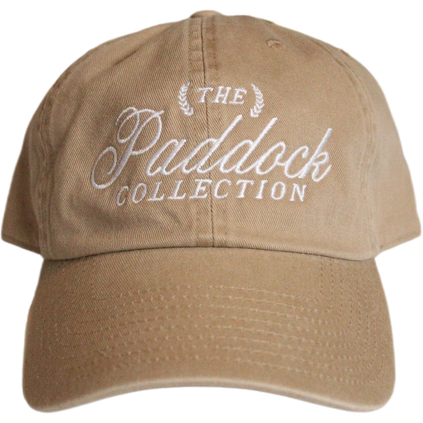 A beige hat with white embroidery The Paddock Collection for Formula 1 fans