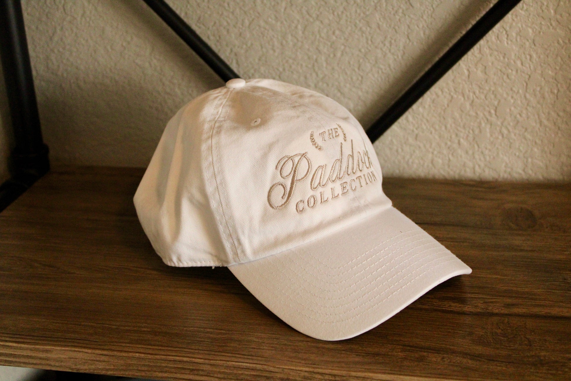 A white hat with beige embroidery The Paddock Collection for Formula 1 fans